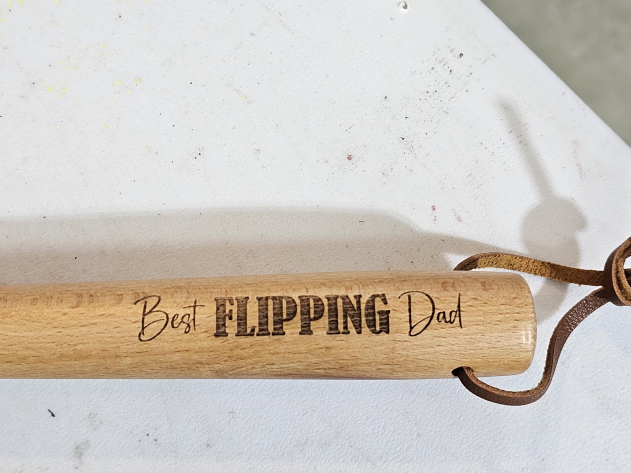 Close up photo of engraved “Best Flipping Dad”